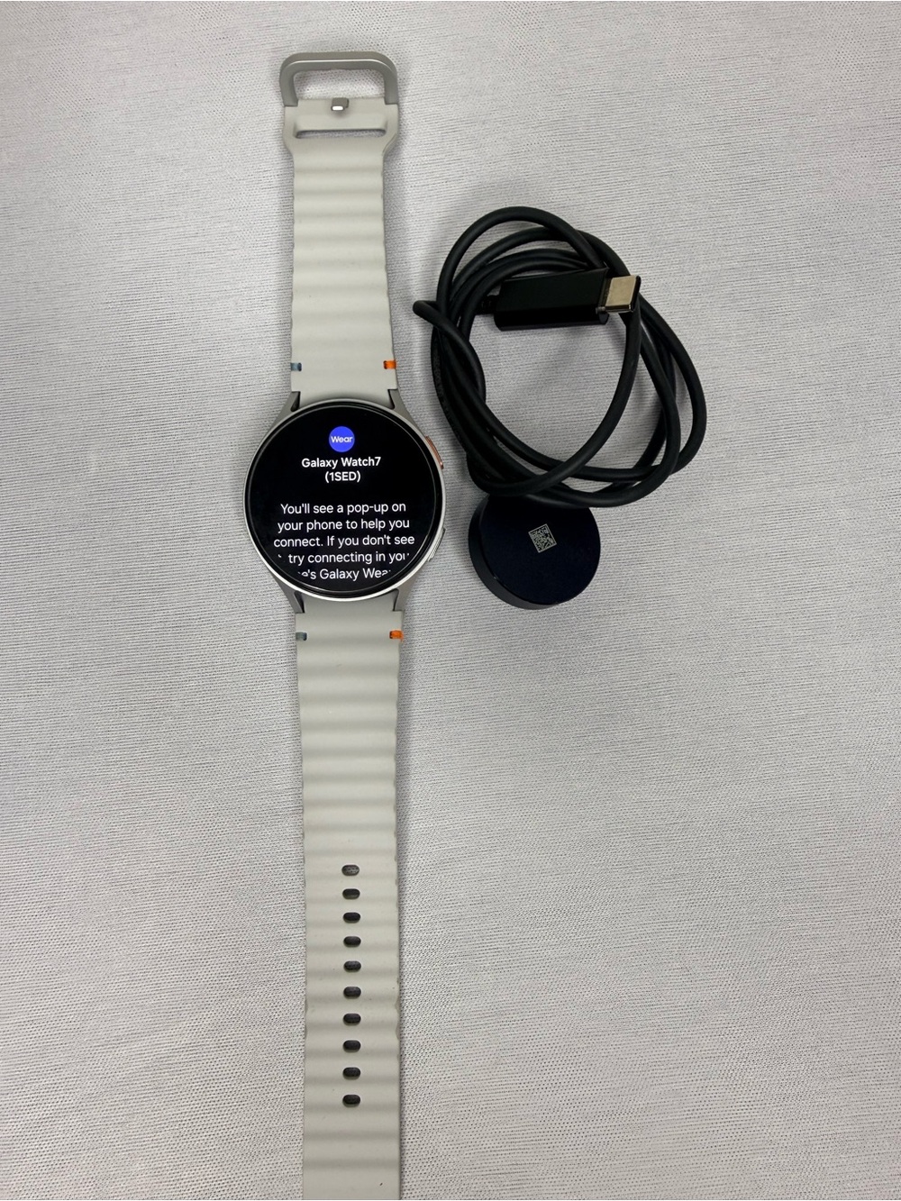 Samsung Galaxy Watch7 Silver Case with White Silicone Band